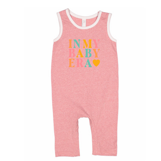 Pink baby romper with colorful text on a white background