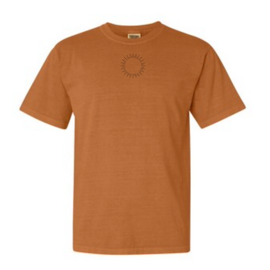 Orange t-shirt with a small graphic on a white background