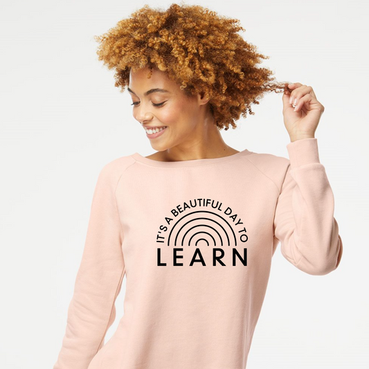 It's A Beautiful Day To Learn Crewneck Sweatshirt in pink on a female model.
