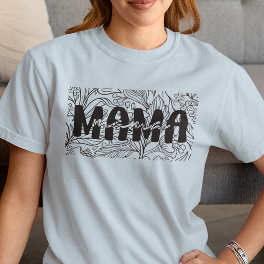 Person wearing a light blue t-shirt with 'MAMA' printed on it.