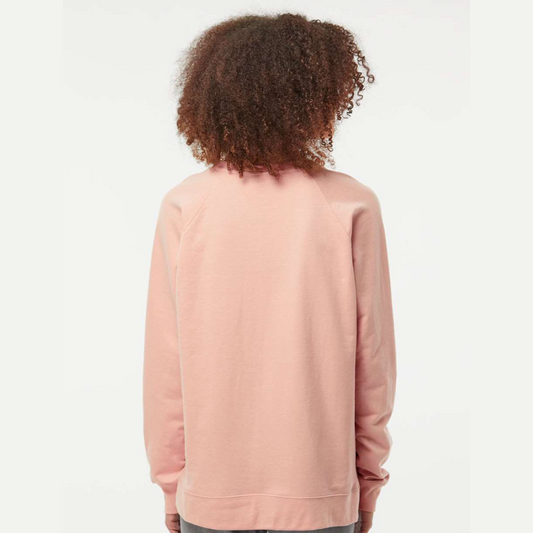 Person wearing a light pink sweatshirt on a white background