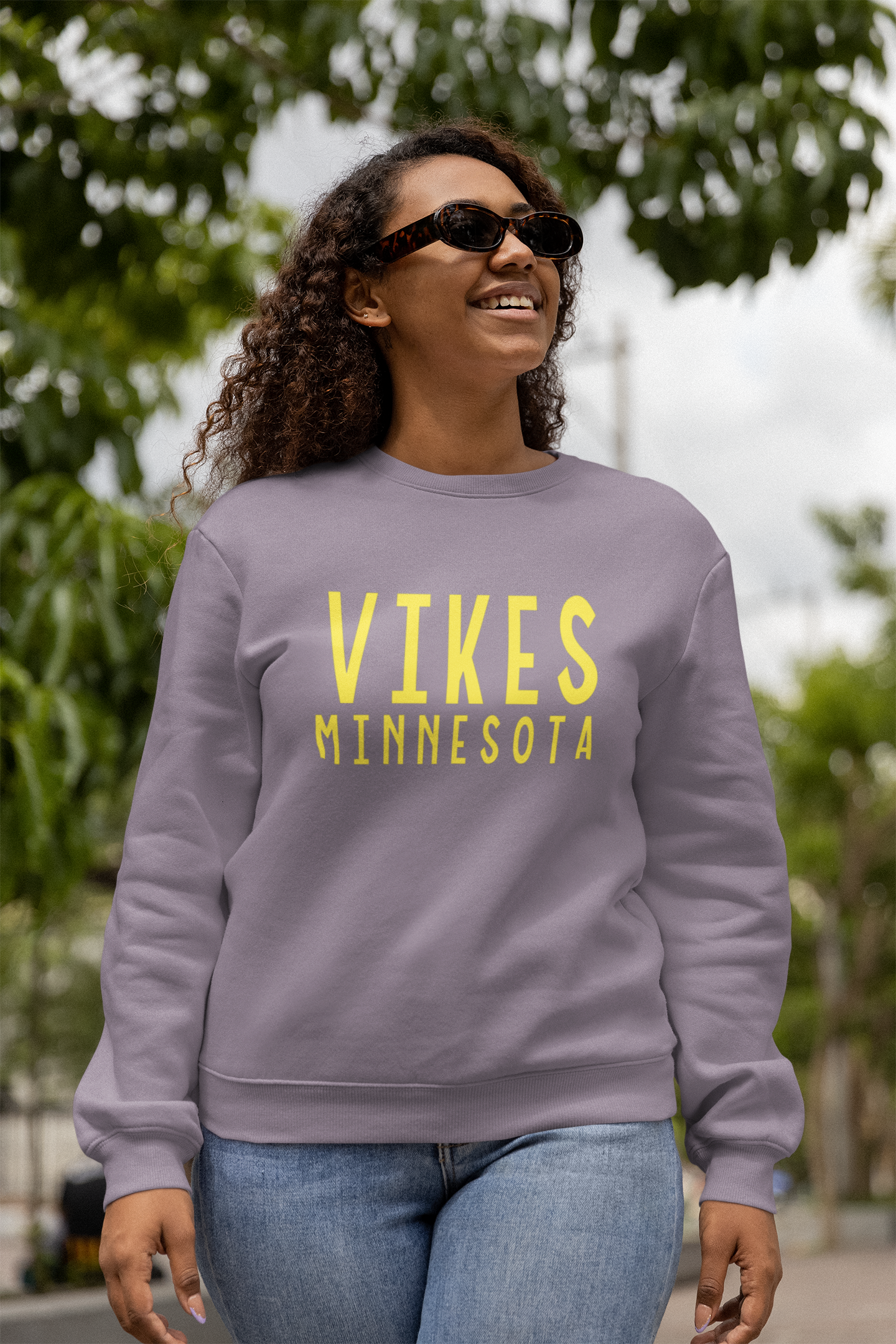 Minnesota Vikings Crewneck Sweatshirt on a model walking outside