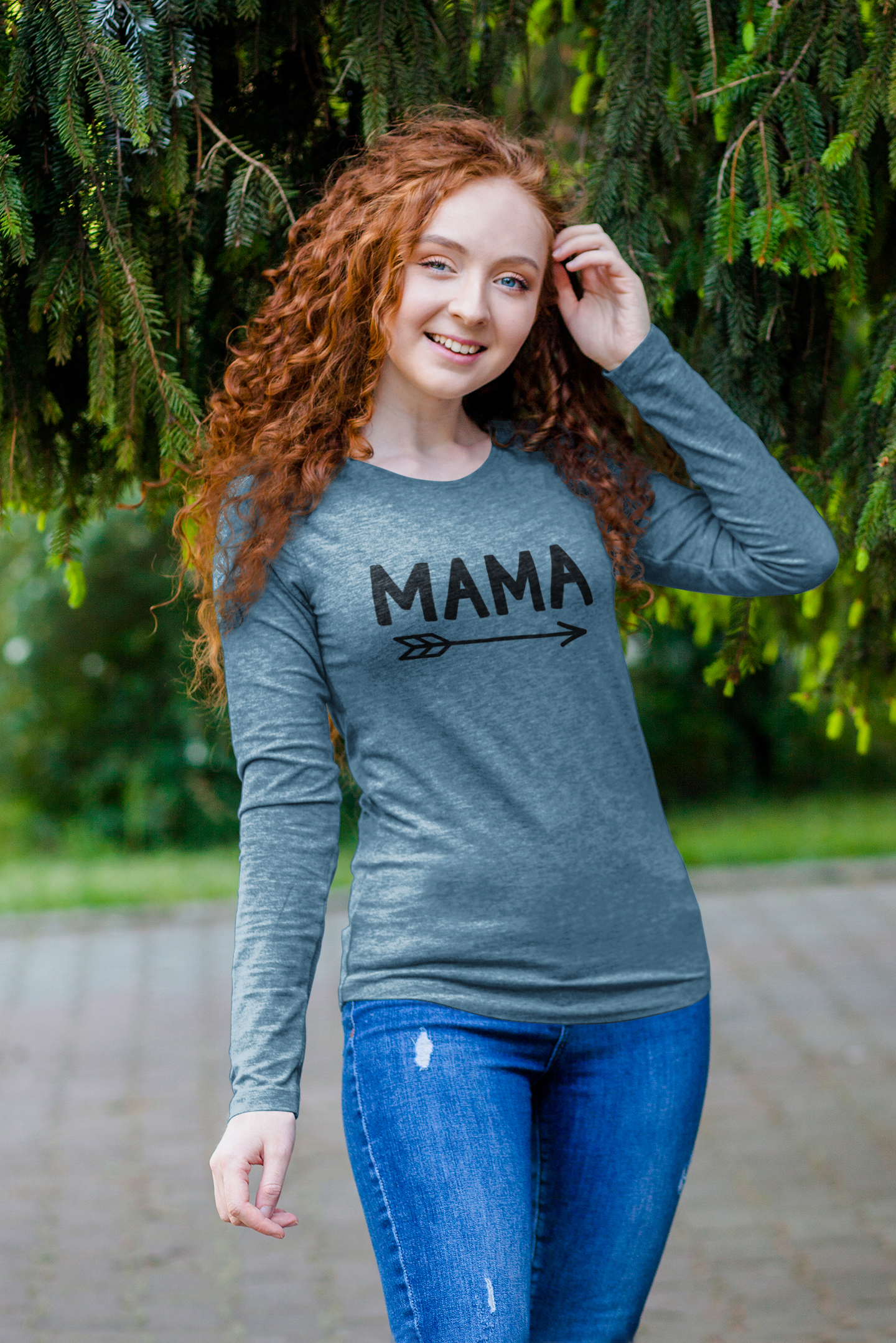 Mama Long Sleeve Shirt on a female model in a greenery setting wearing the shirt.