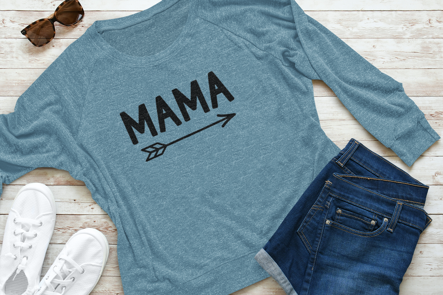 Mama Long Sleeve Shirt in blue laid out flat with white tennis shoes, shorts and sunglasses next to it.