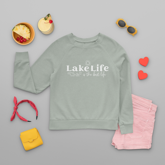 Lake Life Is The Best Life Crewneck Sweatshirt - front view laid out with accessories surrounding it.