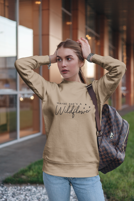 Maybe She's A Wildflower Crewneck Sweatshirt - on a female model posing with a backpack on her shoulder in front of a building