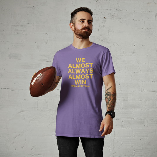 We Almost Always Almost Win Minnesota Vikings T-Shirt - on a male model holding a football