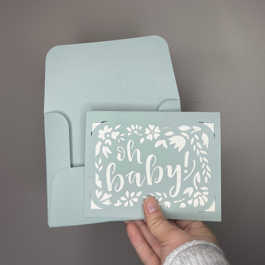 Oh Baby Greeting Card in blue with a white background on the card.