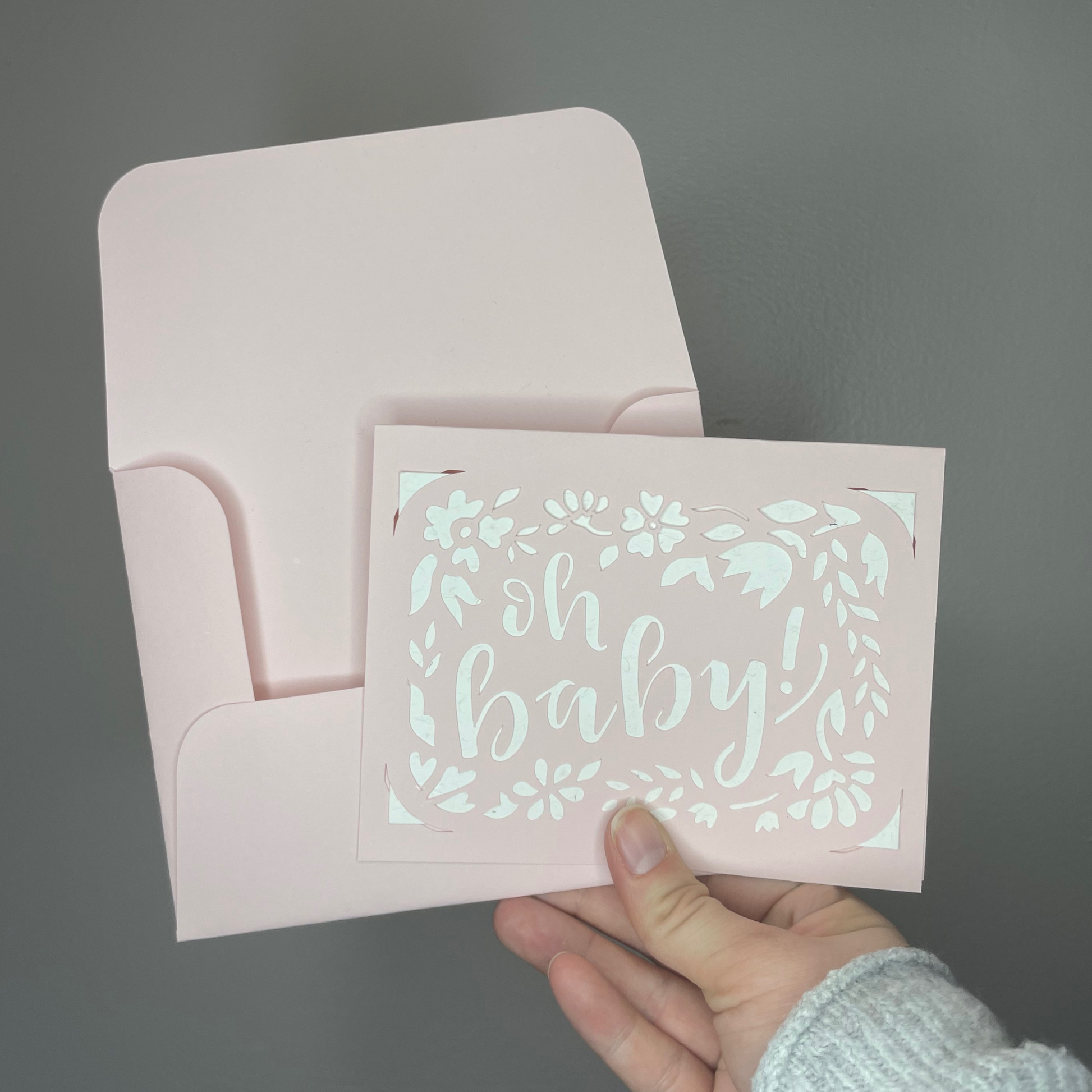 Oh Baby Greeting Card in pink with a white background.