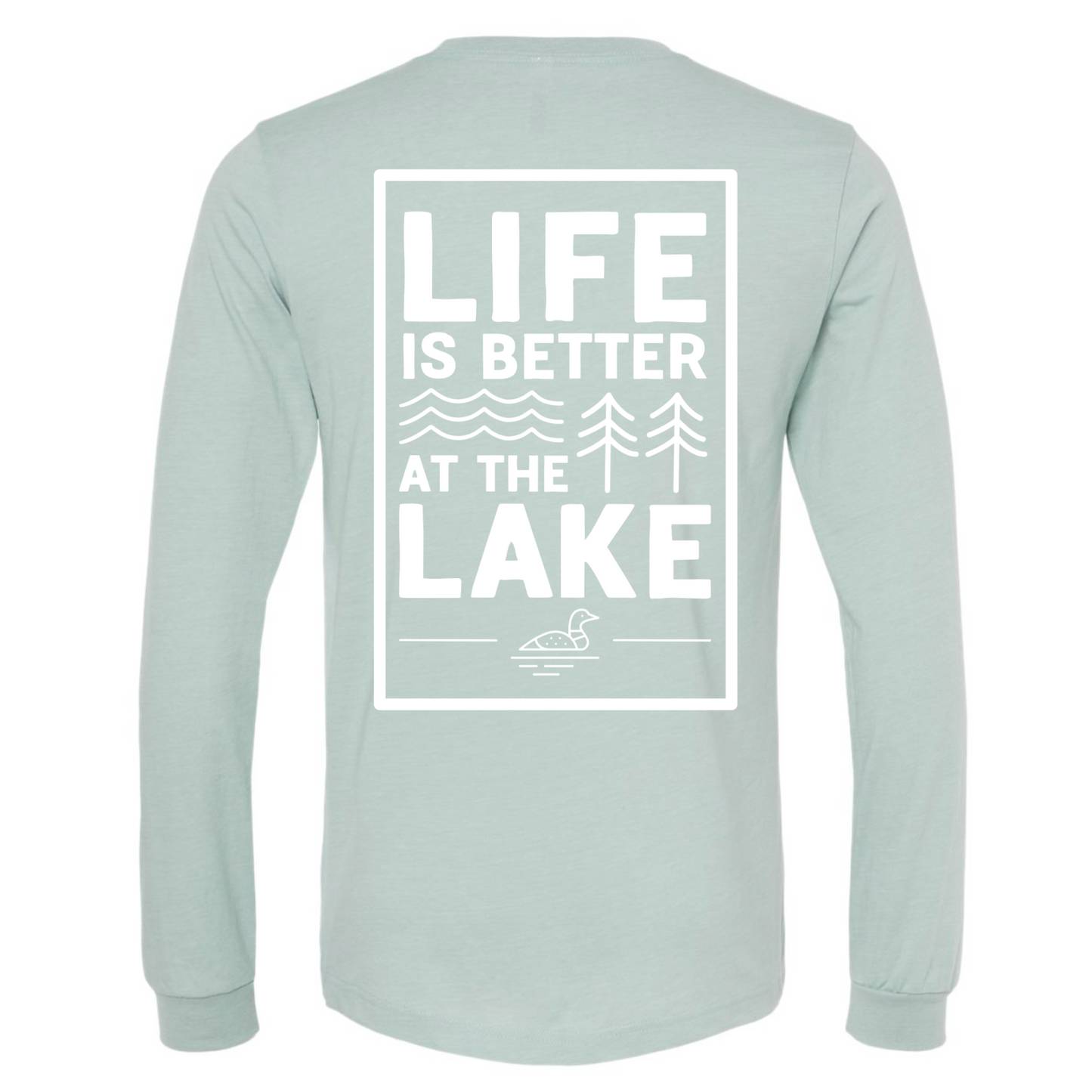Life is Better at the Lake - Long Sleeve T-Shirt in heather dusty blue. The back of the shirt has a white design with the saying "Life is better at the lake" with lake waves, pine trees, and a loon all squared into a frame. The front has the saying "lake bum" with a lake wave and sun all boxed into a hexagon on the small square pocket (right). This is the back view of the shirt.