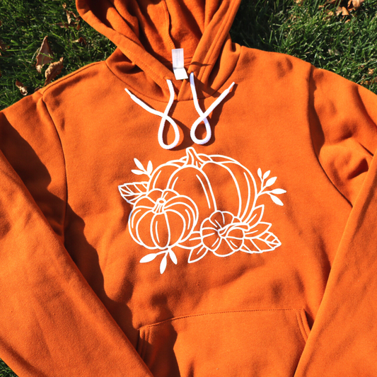 Fall Pumpkin - Hoodie laid out on grass background