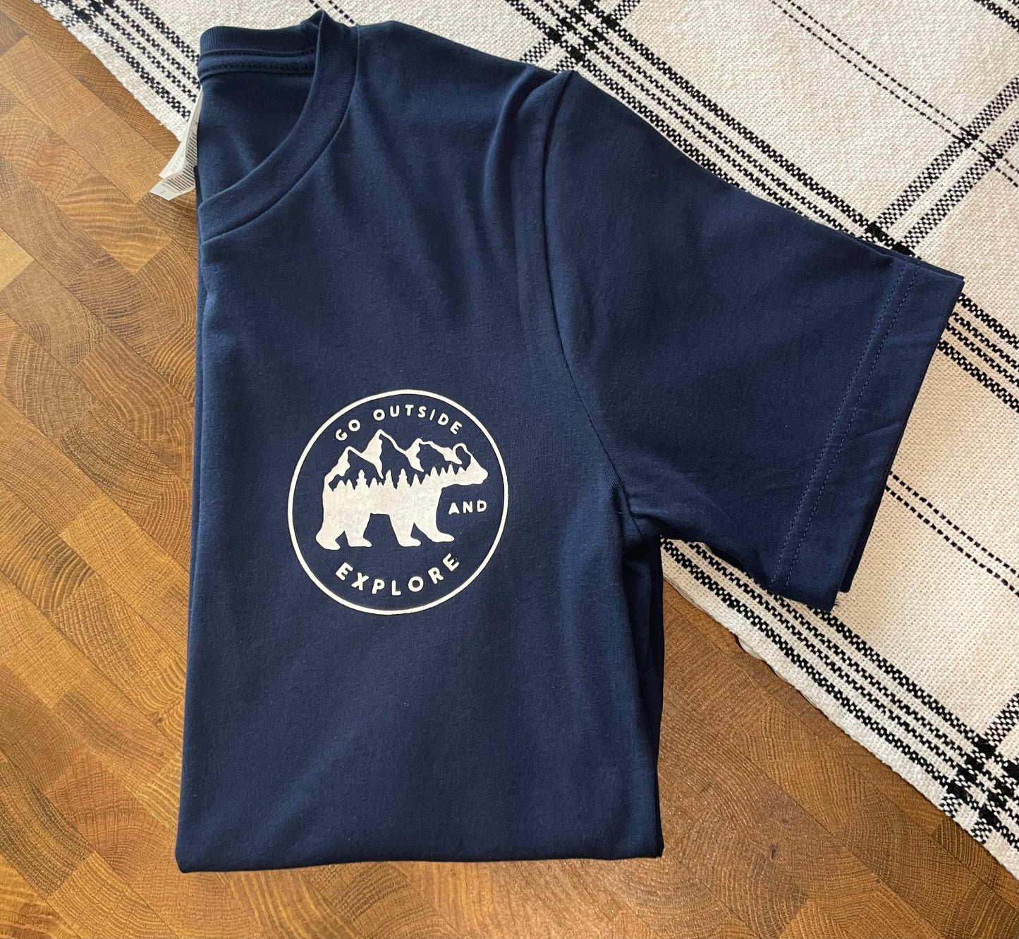 Go Outside & Explore - T-Shirt - folded front pocket view - stylized