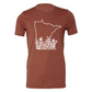 State of Minnesota outline with flowers ranging up the state in white on a heather clay shirt by bella canvas. Front view of the t-shirt.