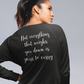 Not Everything That Weighs You Down - Pull Over Sweatshirt in charcoal gray. The back has a white cursive saying of "not everything that weighs you down is yours to carry" with the front corner pocket saying in a cursive font in white of "keep smiling". This is the back view of the sweatshirt on a model posing