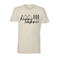 Happy Camper T-Shirt in Heather Oatmeal. The front has a cursive font "happy" with "camper" below it in a bold lowercase font. Two triangle mountains are above the word happy, and three pine trees are above the word camper. The design is in black. This is the front view of the shirt.