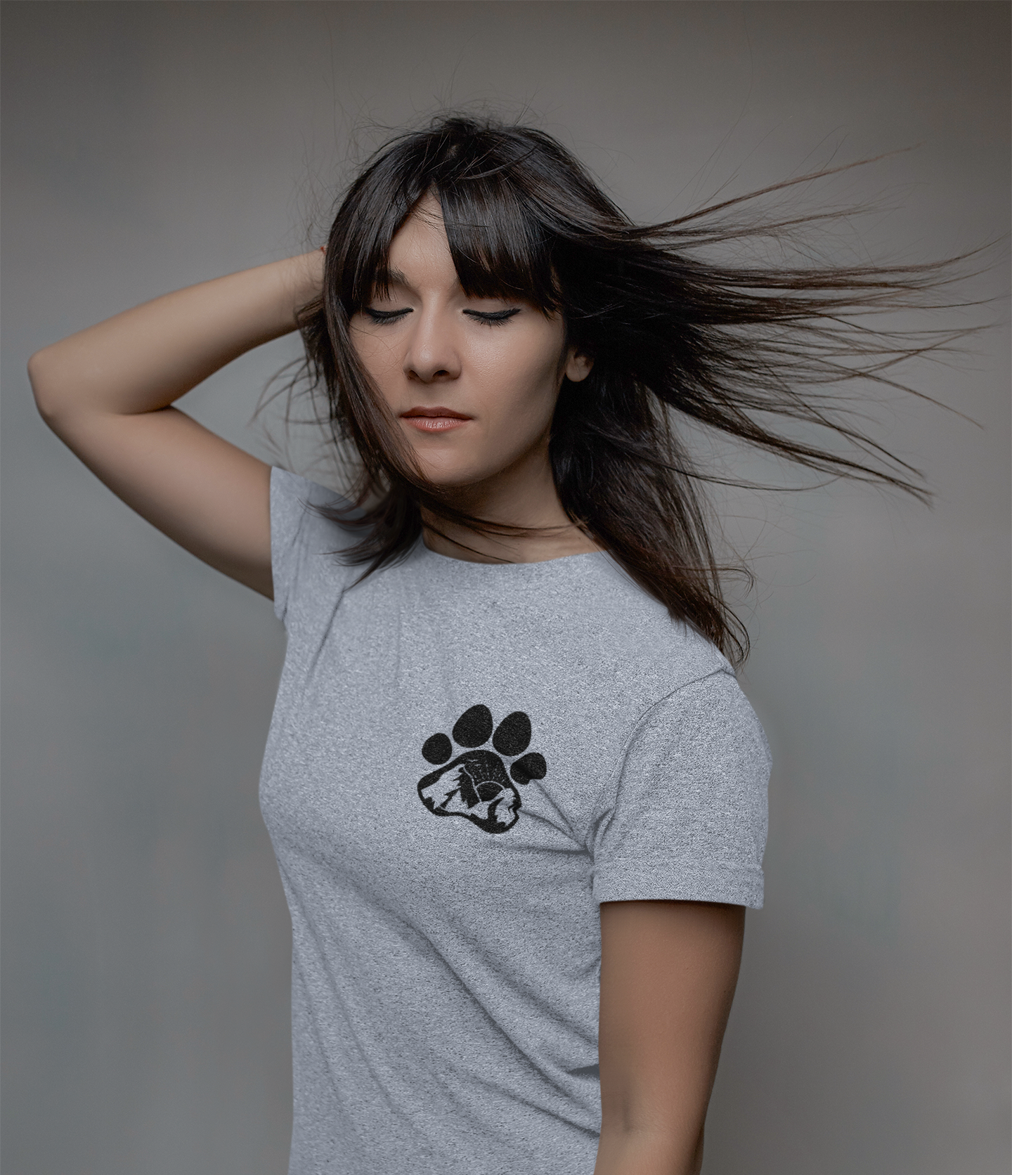 Labrador Mom Shirt - Black design on a dusty blue shirt (Front view) - paw print with the mountains, sun and birds on the corner pocket. Shirt is on a model with a black gray background.