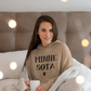 Minnesota - Hooded Sweatshirt on a model hanging out in bed