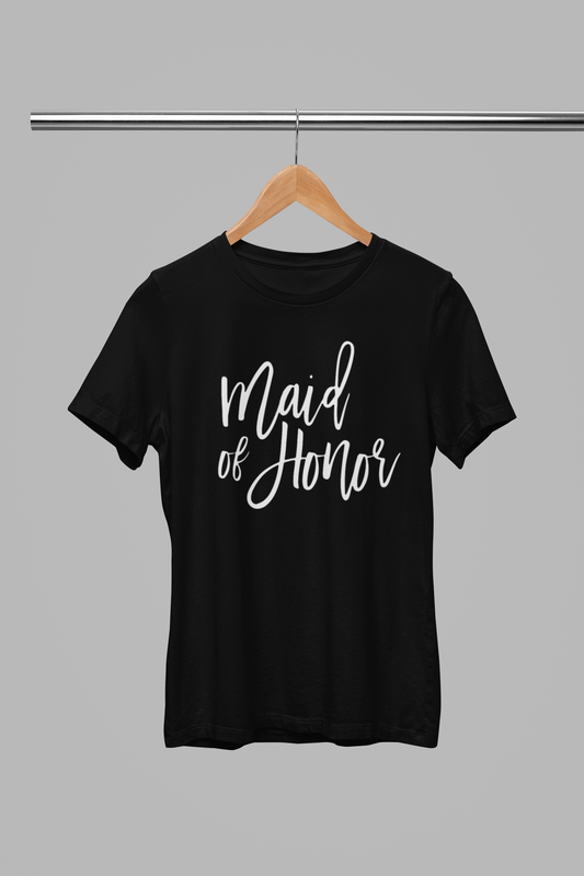 Maid of Honor T-Shirt in black with white script font writing on the front. This is the front view of the shirt hanging on a wooden hanger, hanging on a metal clothing rack.