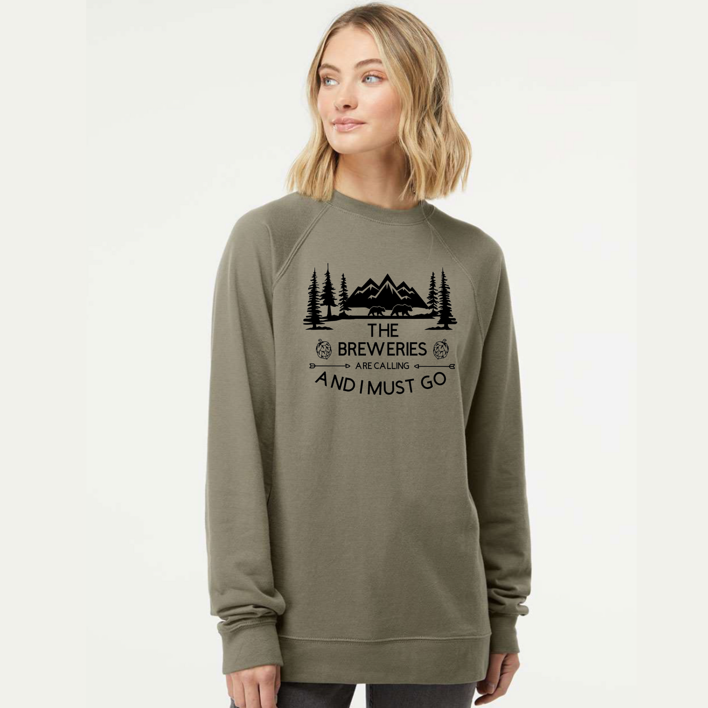 Woman wearing a green sweatshirt with a graphic design and text on a white background