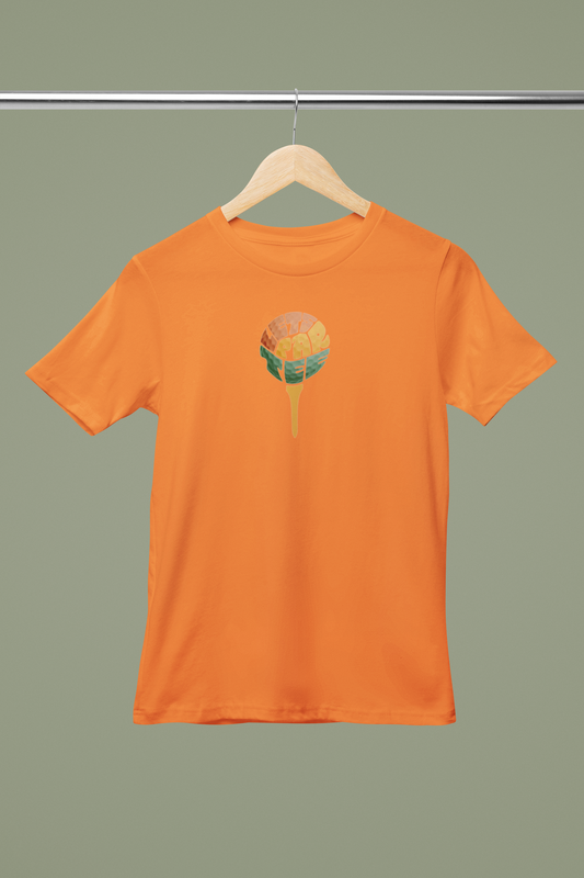 Orange t-shirt with a colorful graphic on a hanger against a green background