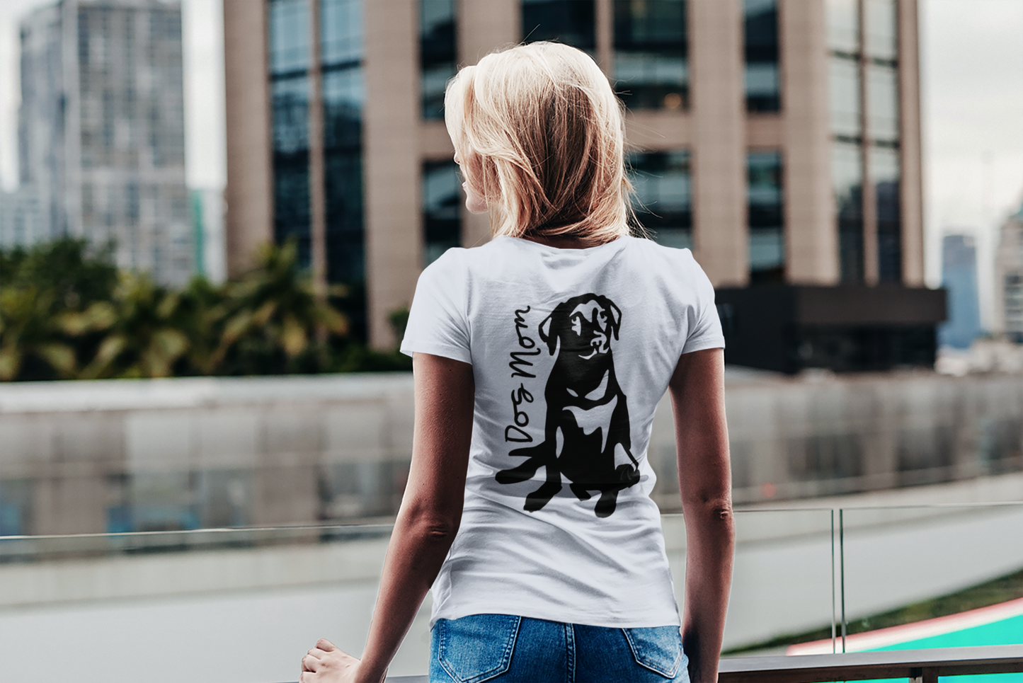 Dog Mom T-Shirt - Back View with a Labrador on the back on a model with a city background