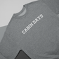 Cabin Days Sweatshirt Laid out Sweatshirt on a 3-toned background.